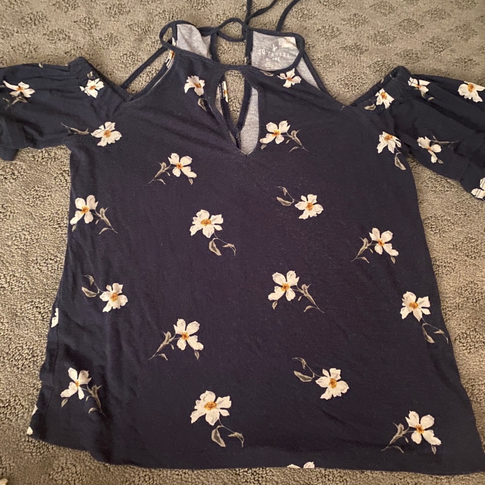 A blue floral off the shoulder blouse